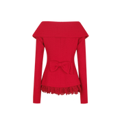 Red top with a bow detail on a white background
