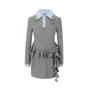 Gray dress with ruffled details and light blue collar on a white background